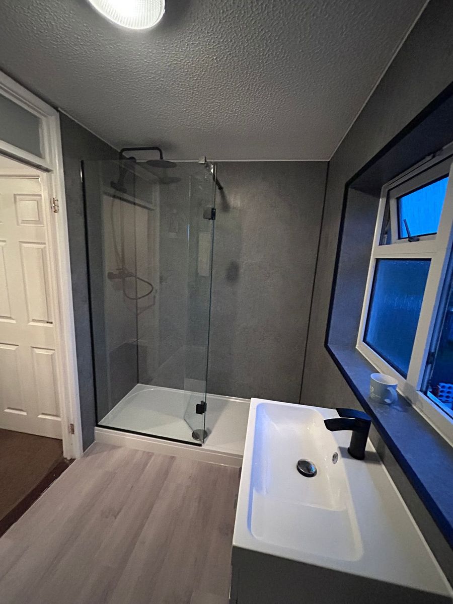 Grey walk-in shower and vanity unit